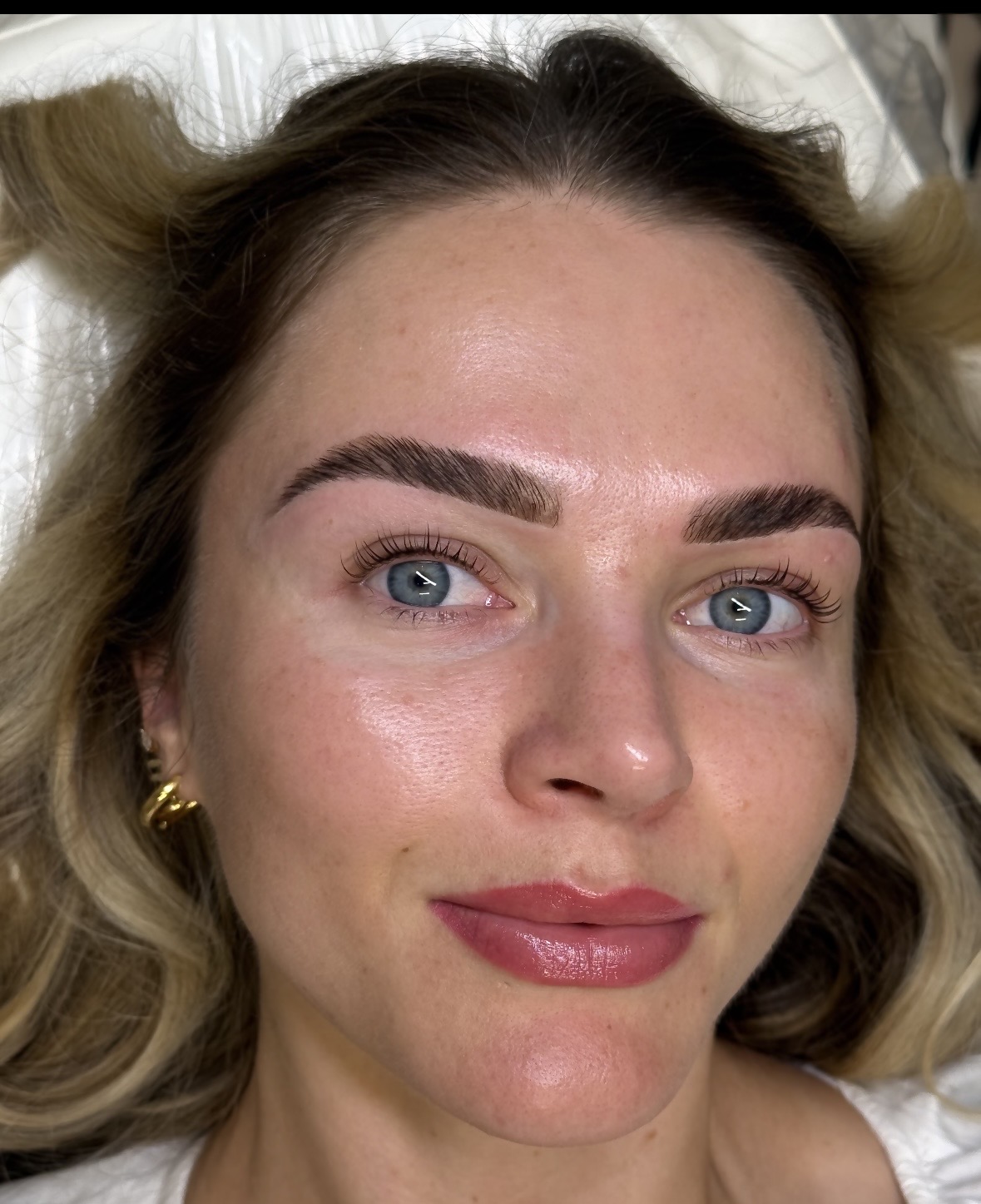 Client showing a lifted and fuller looking brow lamination result